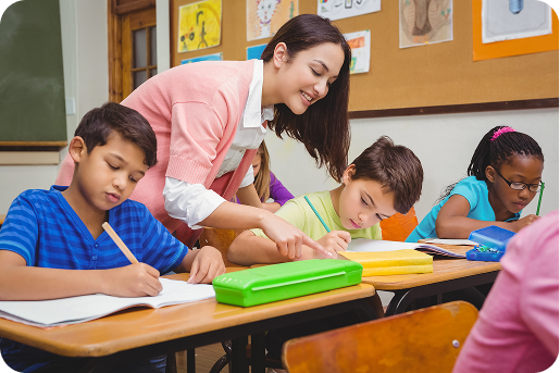 Smiling teacher helping a student